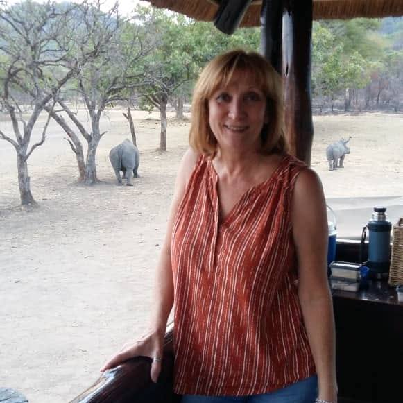 Petra, the artist behind Sunwoven, on safari in Zimbabwe with elephants in the background
