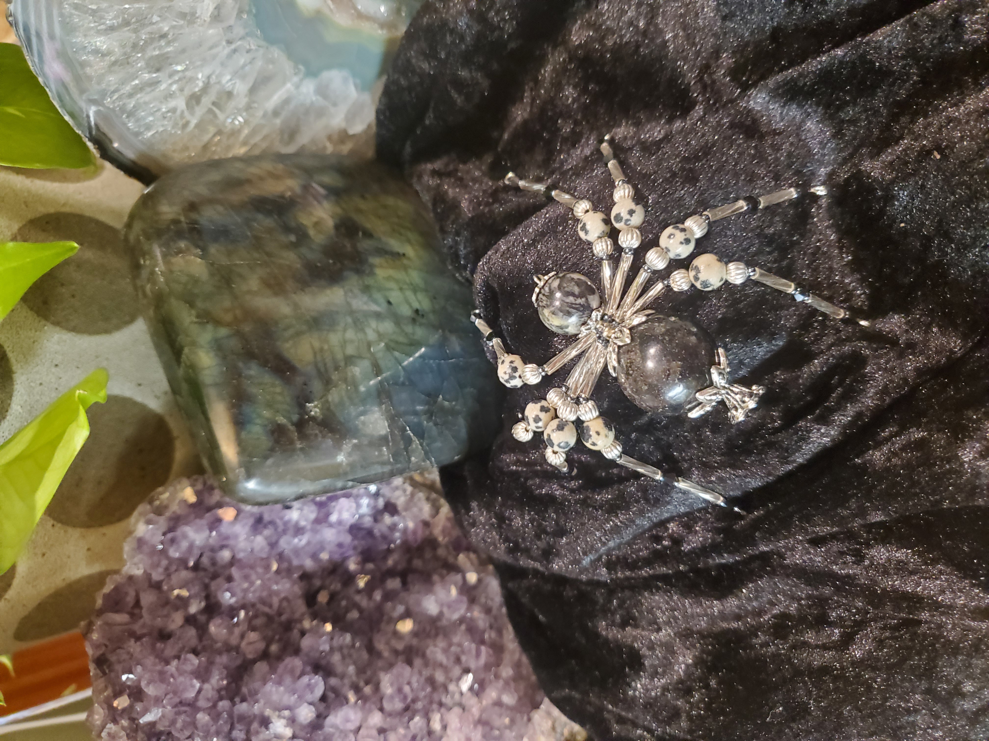 Crystal Frost Spider with amethyst crystals background